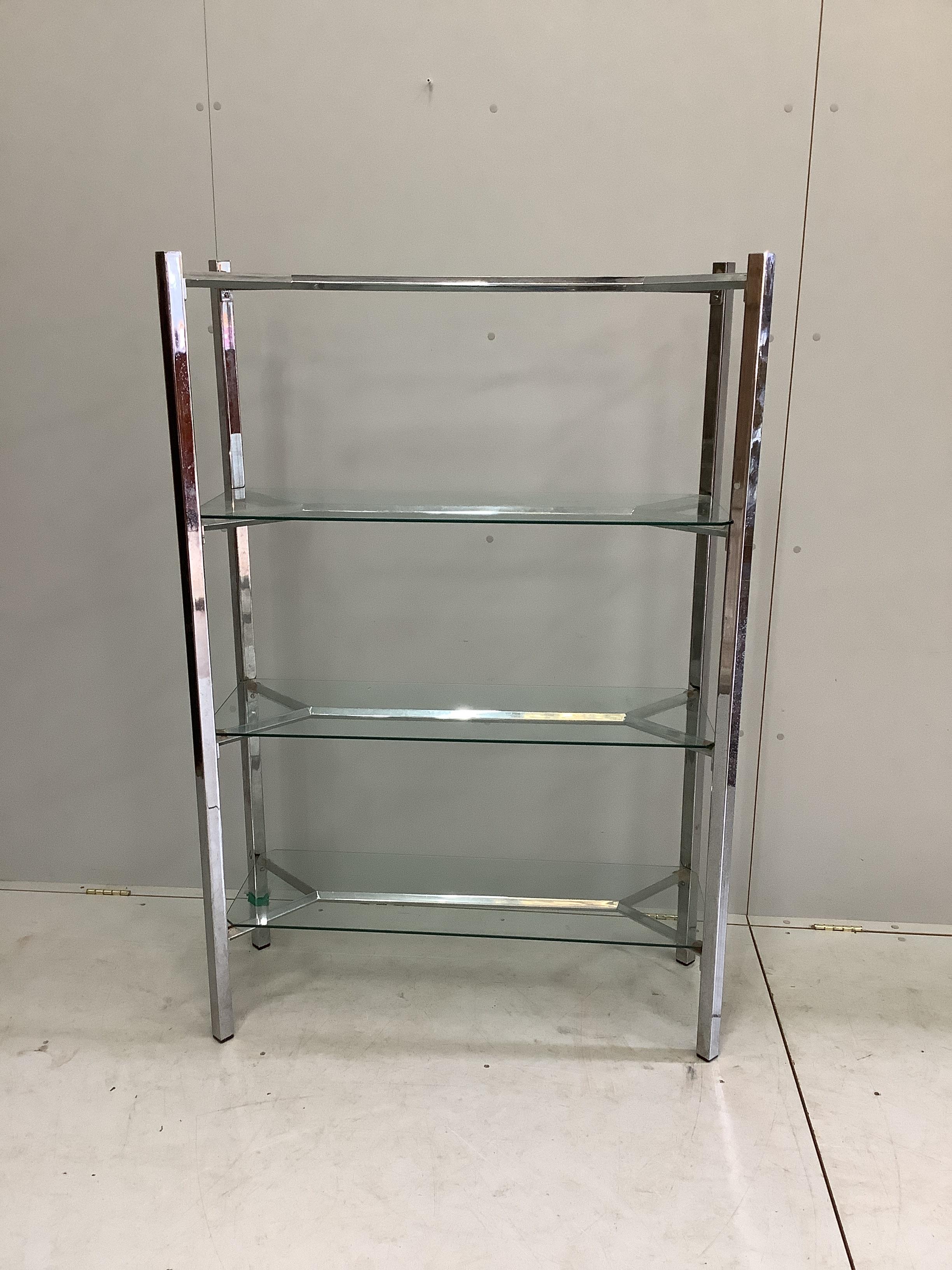 A contemporary chrome and glass three tier shelf unit, width 99cm, depth 38cm, height 147cm. Condition - fair